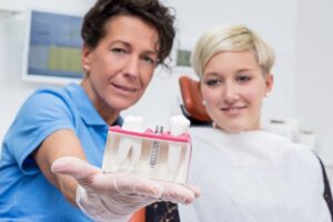 Dentist discussing dental implant with patient